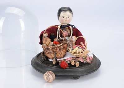 Lot 434 - A German 1910/30s pegged wooden pedlar doll