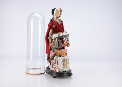 Lot 437 - A late 19th Century German pegged wooden pedlar doll