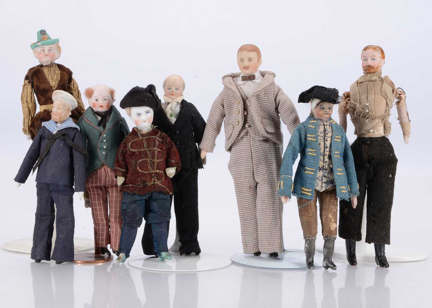 Lot 636 - Eight bisque shoulder-head dolls’ house male dolls