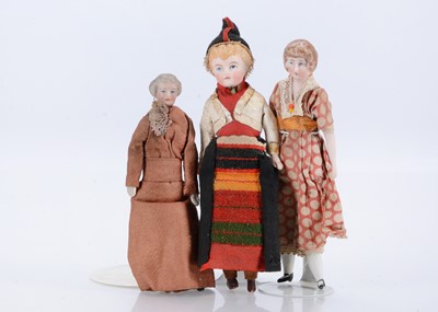 Lot 642 - Three bisque shoulder-head dolls’ house dolls