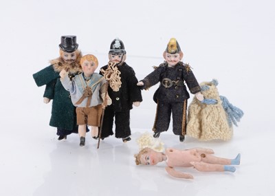 Lot 649 - Three small all-bisque pin-jointed dolls with moulded hats
