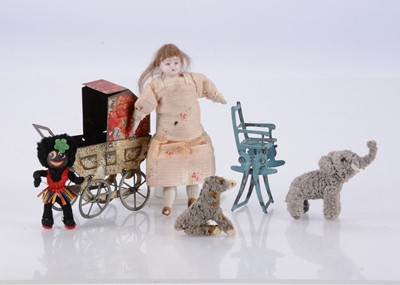Lot 667 - A tinplate dolls’ house perambulator from the Margaret Towner collection