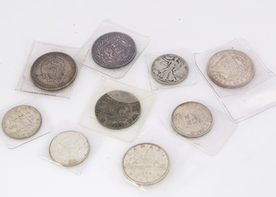 Lot 238 - A collection of nine silver world coins