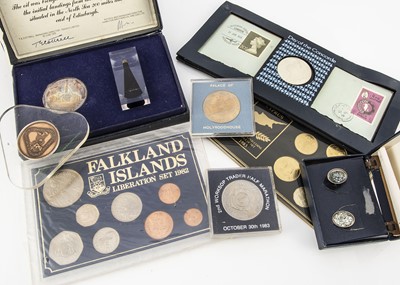 Lot 325 - A small collection of world tokens and uncirculated coin sets