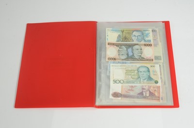Lot 256 - An album of approximately fifty three World banknotes