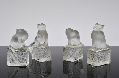 Lot 60 - A group of four Lalique glass cat paperweights designed by Marie Claud Lalique