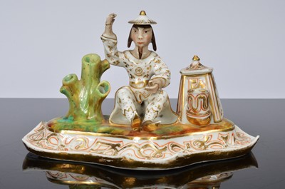 Lot 97 - A late Georgian Staffordshire porcelain figural inkwell
