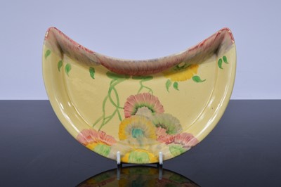 Lot 145 - A Newport Pottery crescent shaped side dish by Clarice Cliff