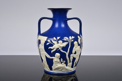 Lot 157 - A late Victorian Jasperware pottery twin handled ewer