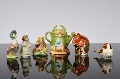 Lot 174 - Two Royal Crown Derby porcelain paperweights and three Beswick Beatrix Potter figures