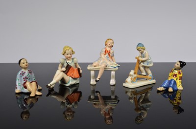 Lot 184 - Three continental ceramic female children figures