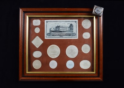 Lot 237 - An interesting montage of bank seals and a metal seal block