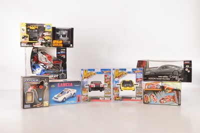 Lot 414 - Modern boxed mostly unused Radio Control Cars and Motorcycle and Engine (9)