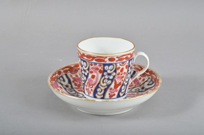 Lot 37 - A late 18th century Worcester 'Queen Charlotte' pattern tea cup and saucer