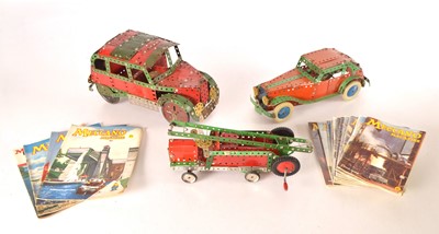 Lot 485 - Three Meccano made up Models using red and green plates and girders circa 1950's together with various Meccano Magazines 1942-1970  (3 models + 21 magazines)