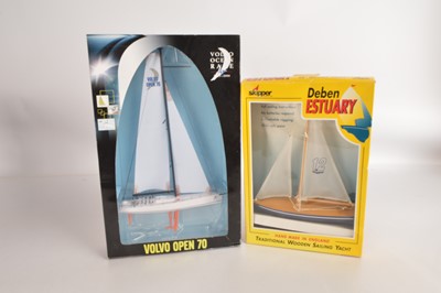 Lot 554 - Skipper 12 Pond Yacht and Motorart Volvo Open 70 Display Yacht both unused in original boxes (2)