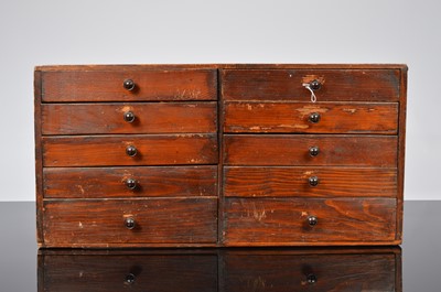 Lot 13 - A vintage watch repairers cabinet and contents