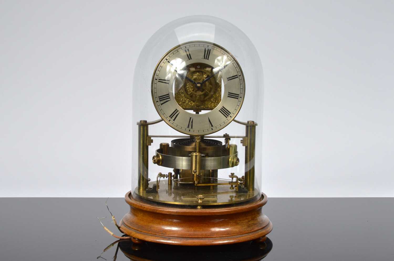 Lot 14 - An early 20th century "Electric Clock" by The Reason MFG Co Ltd
