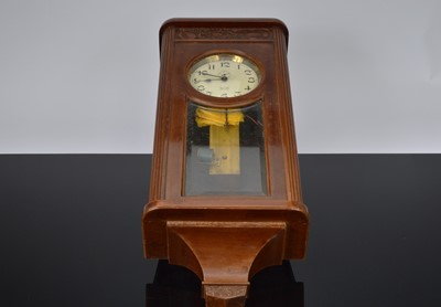 Lot 23 - An early 20th century electric wall clock