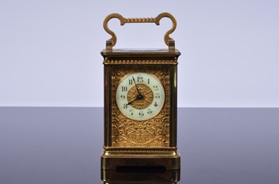 Lot 58 - A late 19th century brass carriage timepiece