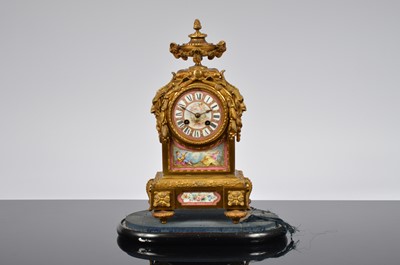 Lot 60 - A late 19th century French ormolu and porcelain mounted mantle clock