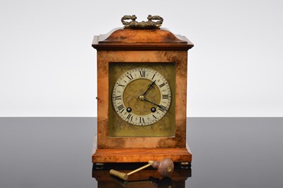 Lot 62 - An Edwardian walnut cased mantle clock