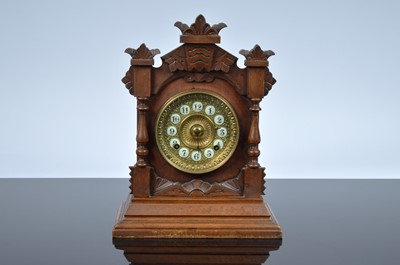 Lot 63 - A late 19th century wooden mantle clock from the Ansonia Clock Co