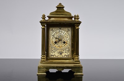 Lot 69 - An early 20th century brass and porcelain mounted mantle clock