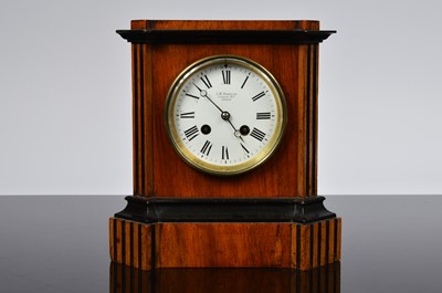Lot 73 - An Edwardian walnut and ebonised mantle clock from J.W. Benson