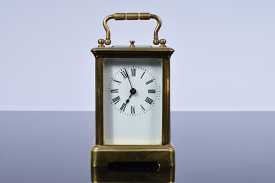 Lot 74 - A small early 20th century brass carriage repeater timepiece