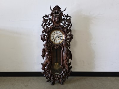 Lot 92 - A Vienna Black forest carved wall clock