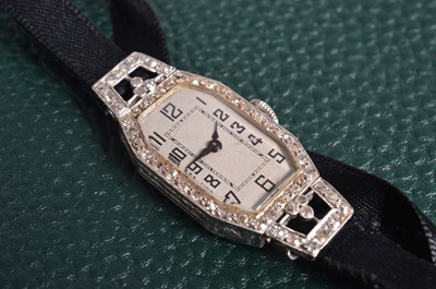 Lot 148 - An Art Deco period platinum and diamond lady's cocktail dress wristwatch