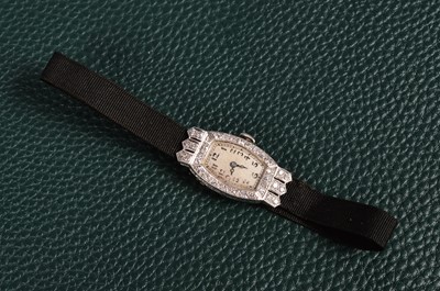 Lot 196 - An Art Deco period Cyma manual wind platinum and diamond lady's cocktail dress wristwatch head