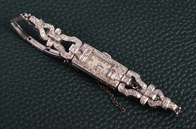 Lot 197 - An Art Deco period manual wind platinum and diamond lady's cocktail dress wristwatch