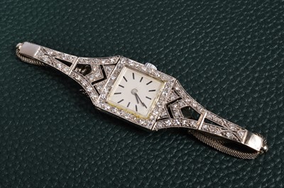Lot 198 - An Art Deco period manual wind platinum and diamond lady's cocktail dress wristwatch