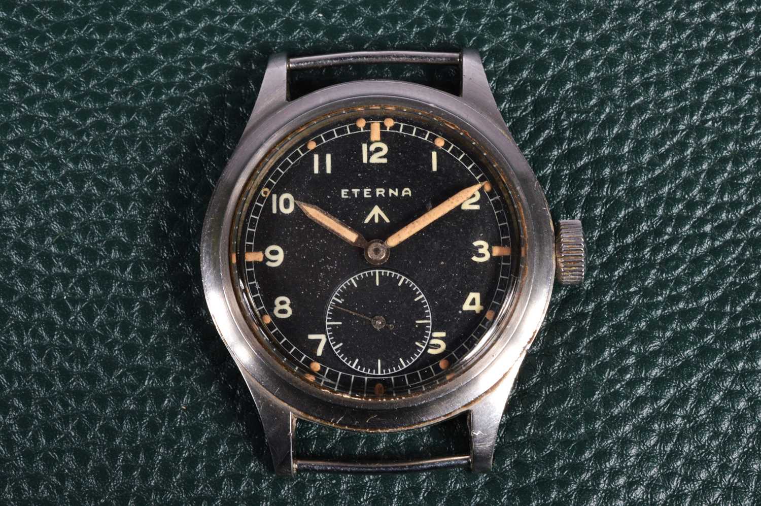 Lot 247 - A WWII period Eterna manual wind military issue "Dirty Dozen" stainless steel wristwatch head