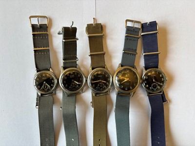 Lot 262 - Five mid 20th century and later manual wind military style wristwatches