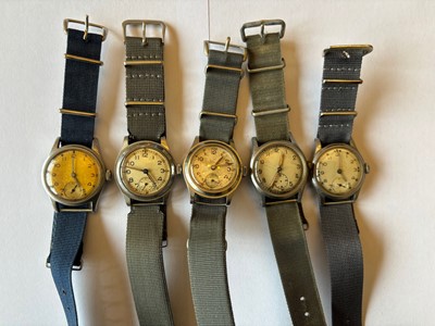 Lot 265 - Five mid 20th century and later manual wind military style wristwatches