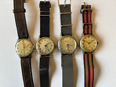 Lot 267 - Four mid 20th century and later manual wind military chromed wristwatches