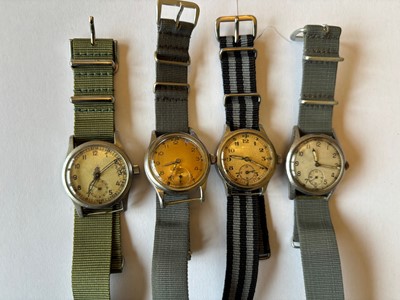Lot 269 - Four mid 20th century and later manual wind military chromed wristwatches