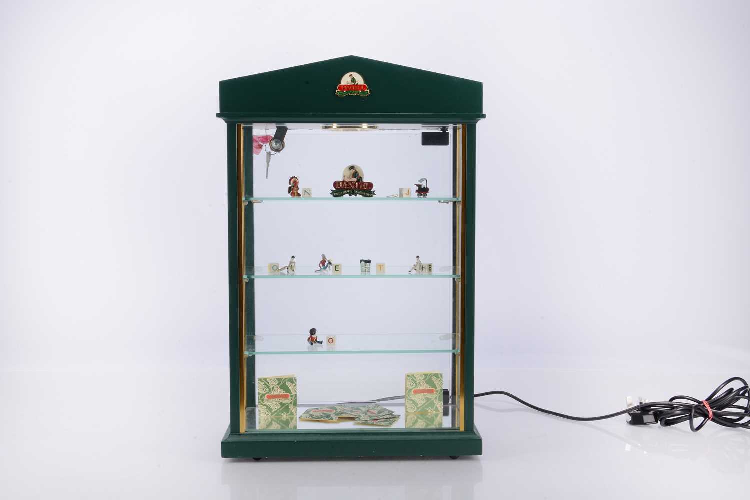 Lot 31 - A Hantel miniatures metal lockable display cabinet with alphabet figures