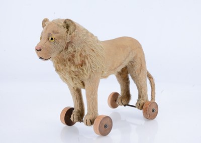 Lot 107 - A 1920s Steiff Lion on wheels