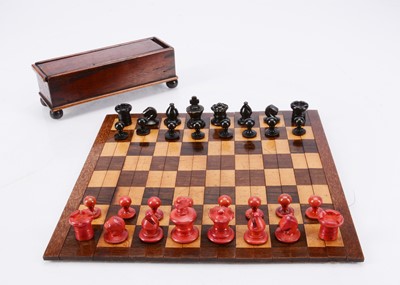 Lot 142 - An early 20th century traveling chess set