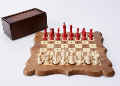 Lot 149 - A late 19th century travelling bone chess set