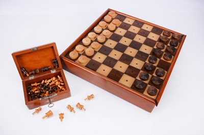Lot 157 - An interesting turned wooden chess set with pegs