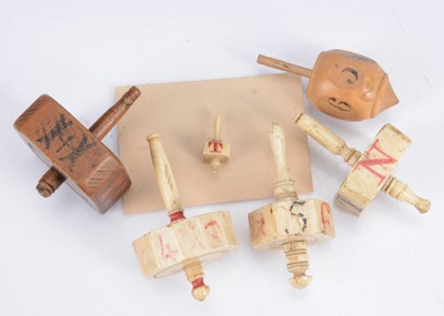 Lot 243 - Four 19th century bone teetotums