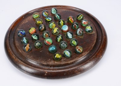 Lot 254 - A large late 19th century turned wooden solitaire board