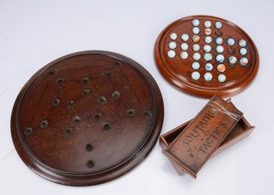 Lot 255 - Two late 19th century turned wooden solitaire boards