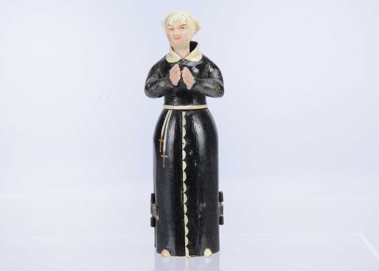 Lot 401 - A mid 19th century Oberammergau wooden figure of a nun with hidden chapel in robes