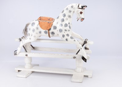 Lot 426 - A small English carved wooden rocking horse